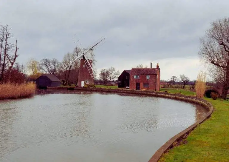 Hunsett Mill a remote water pumping mill extension situated by the River Ant