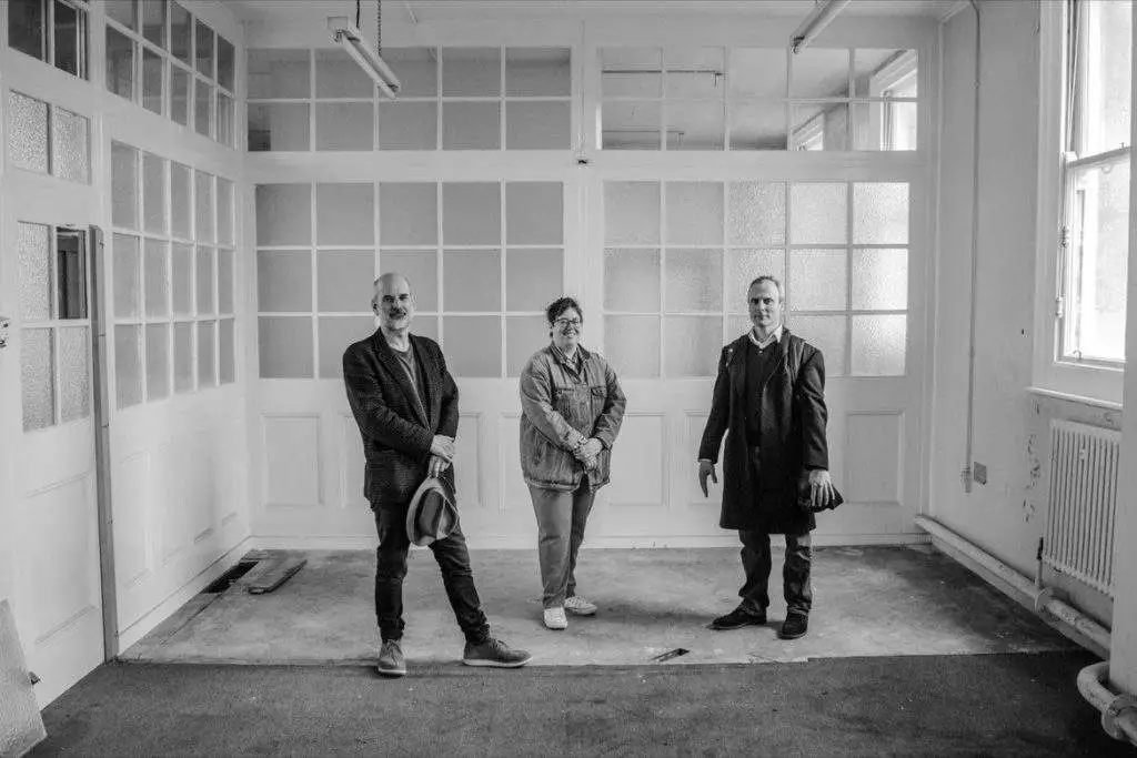 Sculptor Laurence Edwards, Project Manager Helen Johnson and Johnny Messums, inside the Post Office.